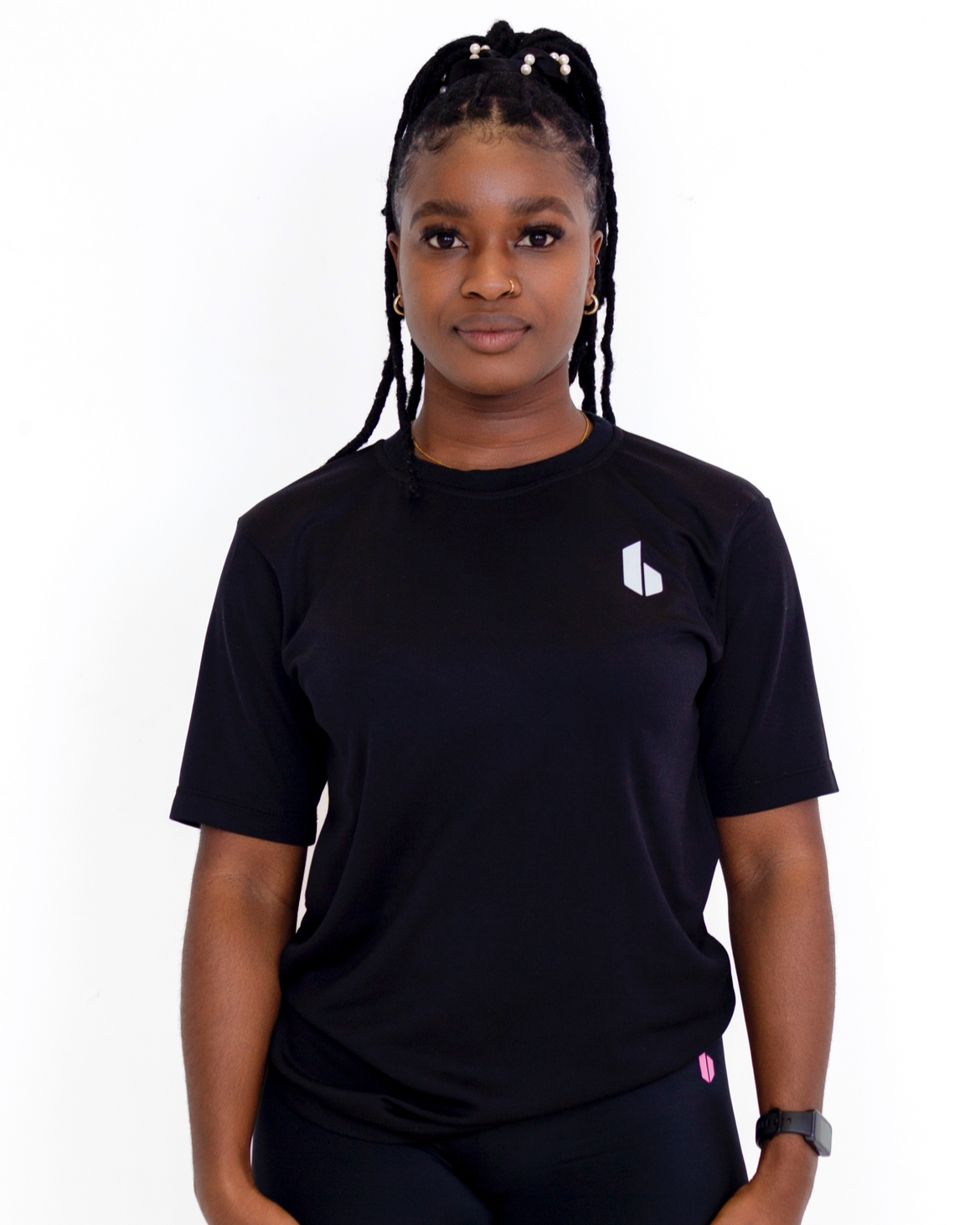Person wearing a black t-shirt with a logo on a white background