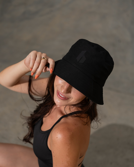 Woman wearing a black bucket hat outdoors